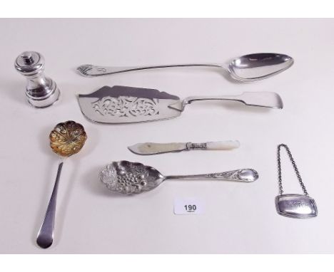 A silver plated pepper grinder, a silver plated basting spoon, fish slice and other cutlery 
