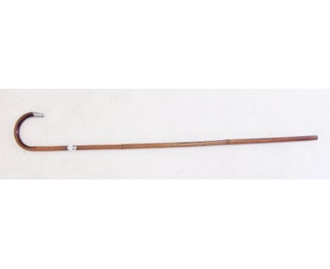 A Malacca walking stick with silver collar and mount