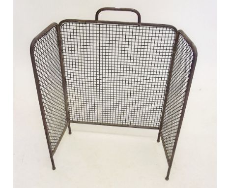 A brass firescreen 