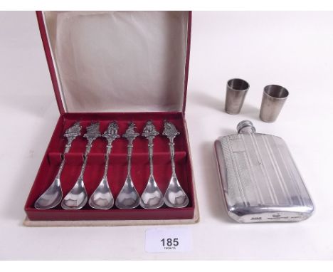 A silver plated spirit flask and three measures and a set of six animal terminal tea spoons 