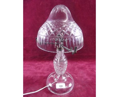 A cut glass table lamp and shade