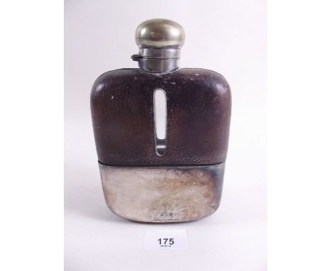 A large size silver plated and leather hip flask 