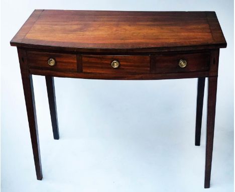 BOWFRONT WRITING TABLE, George III figured mahogany and crossbanded, with a full width frieze drawer (modelled as three drawe