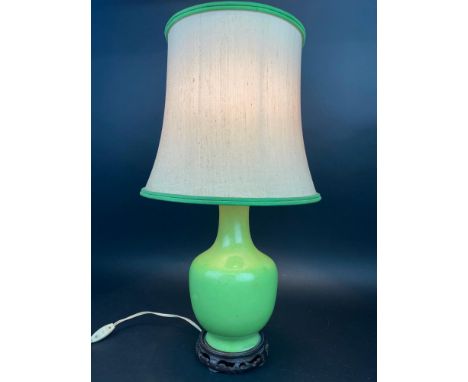 TABLE LAMP, Chinese apple green ceramic fishtail vase with carved hardwood base and linen shade, 62cm H. 