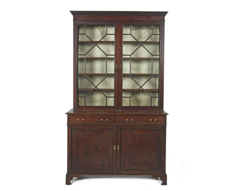 A 19TH CENTURY MAHOGANY COMPOSED BOOKCASE CABINET, with Greek key cornice above twin astragal glazed panel doors on a cupboar