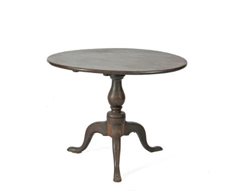 A GEORGE III MAHOGANY CIRCULAR TILT TOP TEA TABLE, on baluster turned centre pillar and outswept tripod base. 92cm wide