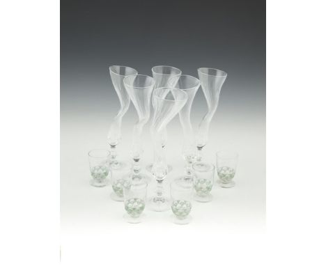 A SET OF SIX FRENCH CLEAR GLASS POSY VASES, Post War, each moulded in irregular form, marked to underside. 24cm high; togethe