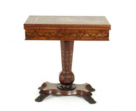 A VICTORIAN KILLARNEY WORK INLAID ARBUTUS AND YEWWOOD FOLDING TOP GAMES TABLE, the top centred with an oval panel depicting M