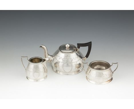 A SILVER THREE PIECE BACHELOR'S TEA SERVICE, Chester 1912, on piece hallmarked only, of domed shape, engraved with ribbon tie