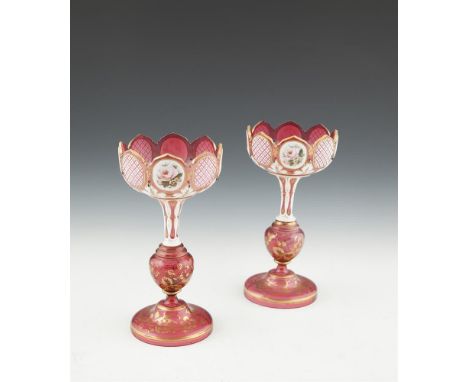 A PAIR OF VICTORIAN RED BOHEMIAN GLASS LUSTRE VASES, with alternating portrait panels. 29cm tall