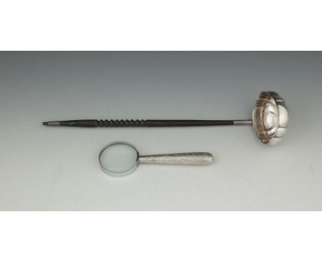 ***DESCRIPTION IN PRINTED CATALOGUE SHOULD READ AN IRISH EBON HANDLED SILVER BRANDY LADLE***AN IRISH EBON HANDLED SILVER BRAN