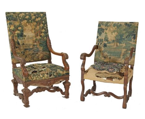 TWO CARVED WALNUT SIDE CHAIRS, in late 17th century style with rectangular panel backs and seats covered in tapestry, seats d
