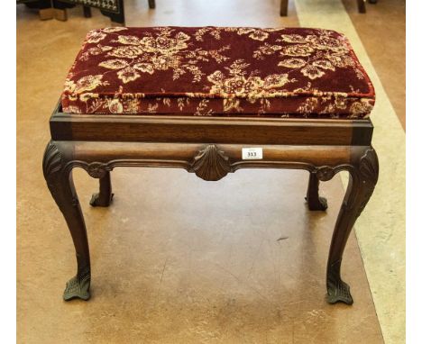 A GEORGIAN STYLE MAHOGANY RECTANGULAR STOOL, the drop in padded seat raised on a shell and rosette carved apron on shell capp