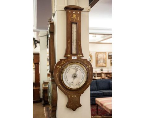 AN ART NOUVEAU STYLE INLAID MAHOGANY BANJO BAROMETER, the case decorated with boxwood and mother of pearl stylised foliage. 8