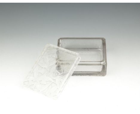 A LALIQUE GLASS BOX AND COVER, dated to 1954, of rectangular form with canted corners, the frosted cover decorated with birds