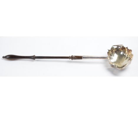 A George III hallmarked silver toddy ladle with shaped oval bowl and turned wooden handle, maker's initial IS & AN, London 17