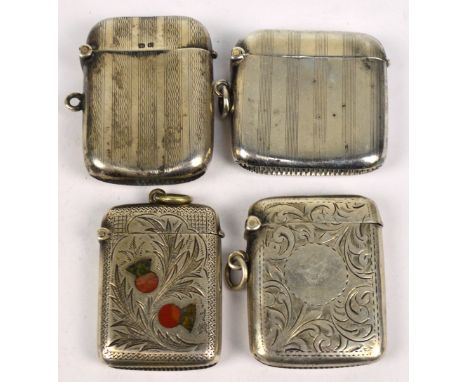 Four variously hallmarked silver vesta cases to include an engine turned decorated rectangular example, 4.5 x 5cm, and foliat