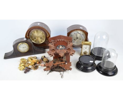 An Edwardian mahogany and mother of pearl inlaid eight day chiming mantel clock, three other various clocks, two domes and as