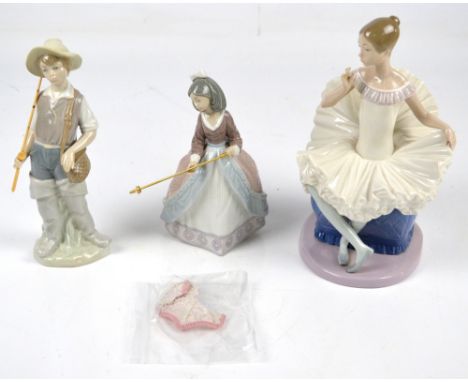 Two Lladro figures, a girl with umbrella and a fisher boy, also a Nao figure of a seated ballerina (3).