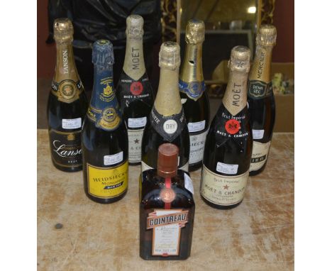 Seven bottles of vintage Champagne including Moët et Chandon, Hiedsieck, Lanson, Mercier etc, also a bottle of Cointreau (8).