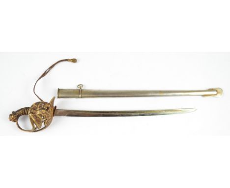 A novelty letter opener/paper knife modelled as a sword with pierced knuckle guard, slightly curved blade and scabbard, lengt