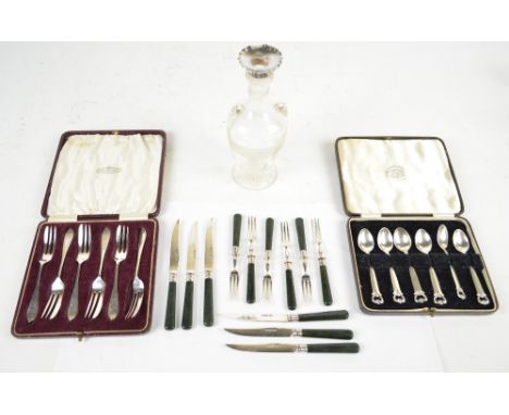 A set of six Edward VII hallmarked silver bladed fruit knives and forks with green hardstone handled fruit knives and forks, 