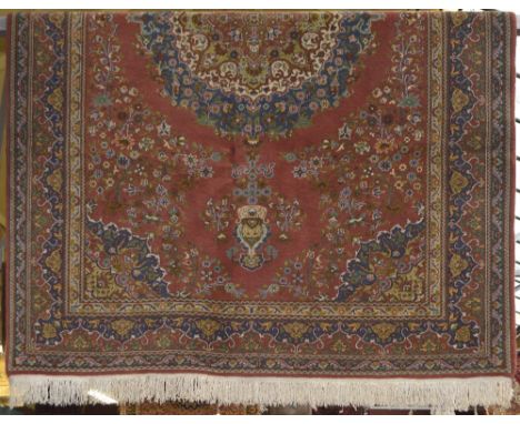 A Turkish Annatolian Konya Ladik double knotted cotton and wool carpet on light red ground, 260 x 167cm, with original receip