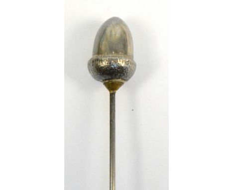 A sterling silver hat pin in the form of an acorn, marked KB, with registered number 597101, head height 1.75cm, on a 20cm pi