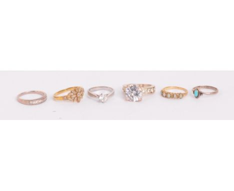 A small collection of dress rings including a 9ct yellow gold floral ring set with diamond chips, size R, a 9ct yellow gold o