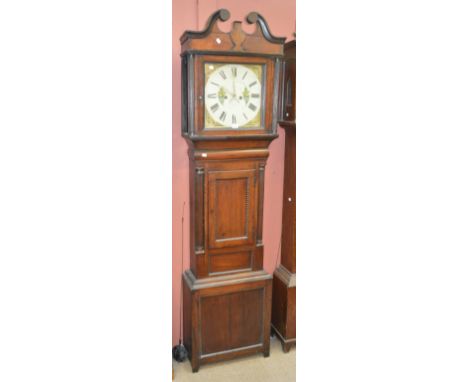 An early 19th century mahogany longcase clock, the hood with broken swan neck pediment above painted dial set with Roman nume