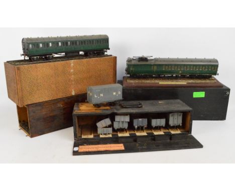 Two 1950s cased scratch built model railway coaches, one inscribed "Manchester South Junction and Altrincham Railway, Model C