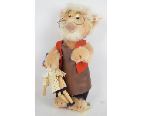 A Steiff limited edition Geppetto bear from 1996, with spectacles and leather apron, with a wooden Pinocchio doll, no.1457/15