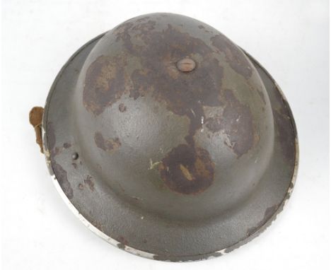 A WWI military helmet with later decal.