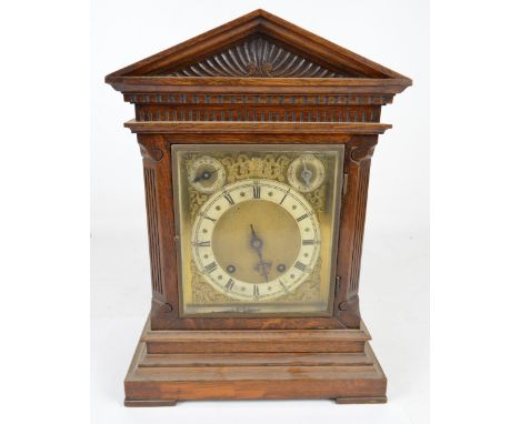 A late 19th century oak cased eight day chiming mantel clock, height 41cm.