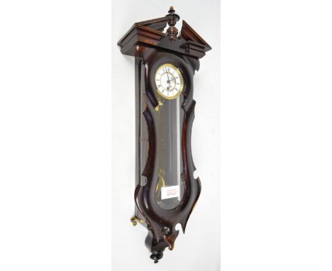 A small Vienna style stained beech single weight wall clock with two piece white enamel dial, length approx 78cm.