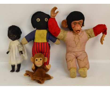 A vintage black Roddy doll with open/close eyes, marked Roddy to the back of the head, height 33.5cm, a vintage monkey toy wi