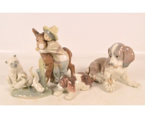 Four Lladro and one Nao animal figures and figure groups. CONDITION REPORT: Appears good with no obvious signs of faults, dam