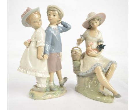 A Lladro figure group of a boy and girl holding hands, height 25.5cm, and a Nao example of seated girl with hen (2).