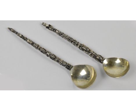 A pair of boxed Canadian sterling silver tea spoons, "The Snow Goose", each with totem pole stylised handles and shaped bowls