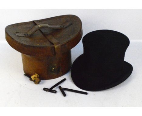 An early 20th century silk top hat, the aperture 20 x 16cm, in leather box, also skull shaped meerschaum pipe and a boxed Swa