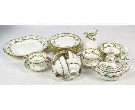 A Hammersley and Co tea service decorated with green swags, comprising six cups and saucers, eight plates, two bread and butt