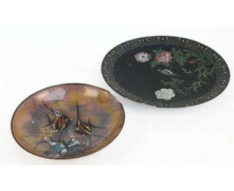 A Japanese Meiji period circular cloisonné enamel charger decorated with a bird perched on blossoming branches within a decor