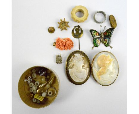 Two yellow metal framed oval cameo brooches, a 9ct yellow gold mounted carved pale coral floral pendant, an enamel decorated 