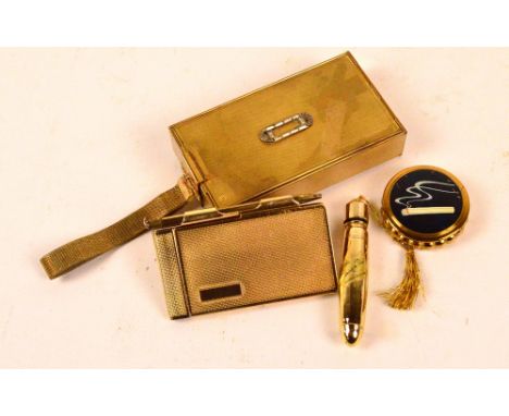 A vintage brass engine turned decorated lady's compact of rectangular form, a similar aide memoir, a bullet shaped perfume bo