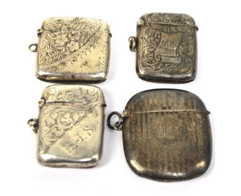 Four variously hallmarked silver vesta cases to include a rounded rectangular example overall engine turned decorated example