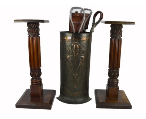 An Art Nouveau copper corner stick stand with stylised Art Nouveau decoration and a pair of torcheres with square section top