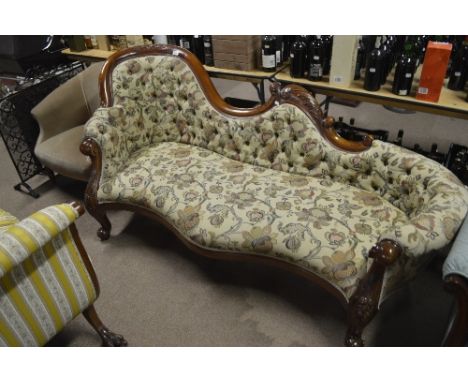 A reproduction mahogany framed button upholstered chaise longue.