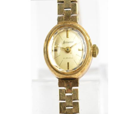 ACCURIST; a 9ct yellow gold cased manual wind lady's wristwatch, the oval dial set with baton numerals on brick link bracelet