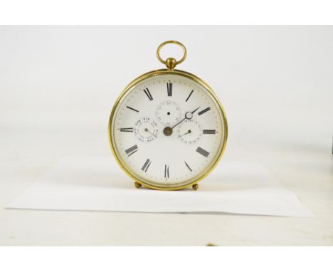 A large early 20th century circular drum clock with ring loop above circular white enamel dial set with Roman numerals, three
