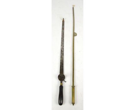 A Victorian iron ratcheting bow with turned wooden handle and traces of maker's name, length 56.5cm and a brass chandelier li